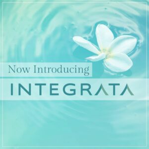 Teal/blue image of water with a floating flower petal, with text that reads "Now Introducing Integrata"
